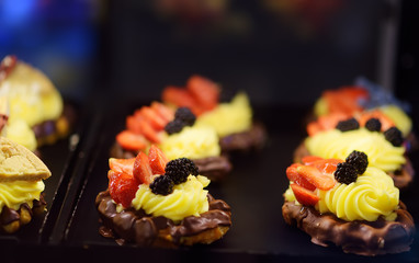 Belgian waffles with chocolate, berries, sweet sauce, cream