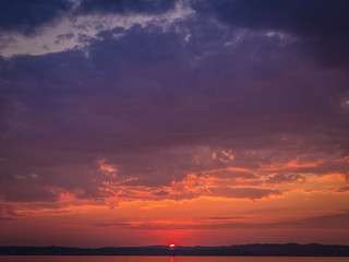Naklejka na ściany i meble Red sunset on the lake