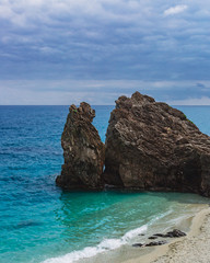 Big rocks by the blue sea in Monterosso, Cinque Terre, Italy