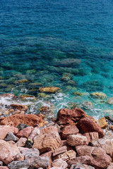 Big rocks by the blue sea in Monterosso, Cinque Terre, Italy