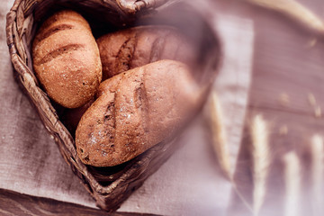 Hot freshly buns in a heart-shaped basket.