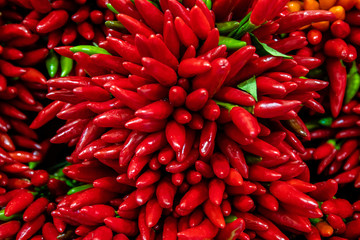 A close up shot of a stack of peppers in a Venice market