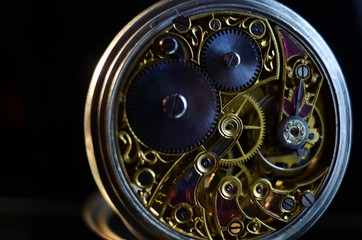 antique mechanical pocket watch, winter time and summer time concept, selective focus.