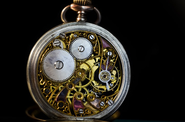 Skeleton Mechanism Vintage Pocket Watch. winter time and summer time concept, selective focus. - Powered by Adobe