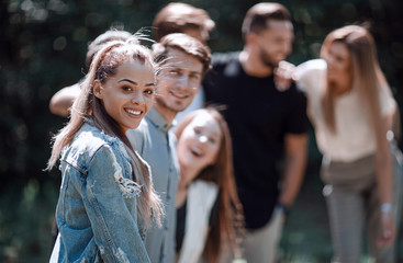 handsome young man in front of his friends