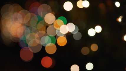 Multi-colored bokeh moving in the distance for green screen