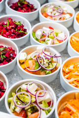 catering table with salads
