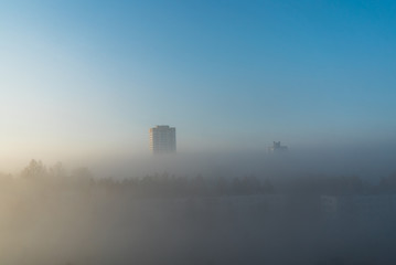 city at misty sunrise