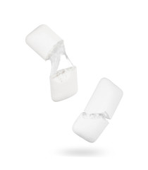 Bubble gum is broken into two halves on white background