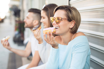 Beautiful woman eating a donut