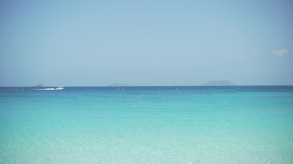 Background Plate of Boat in the distance on open blue Caribbean ocean