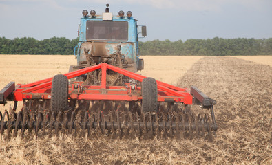 Tractor preparing land for sowing