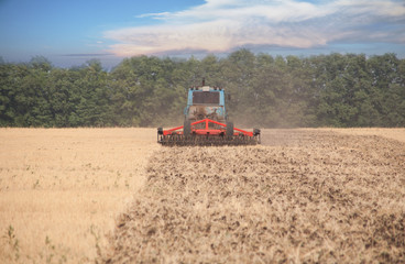 Tractor preparing land for sowing