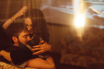 Embracing passionate couple in home cinema room