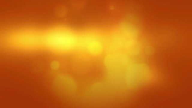 Bright Yellow Orange Abstract Bokeh Looping Video Background.  Vibrant and Subtle Motion Graphics Backdrop Loop.