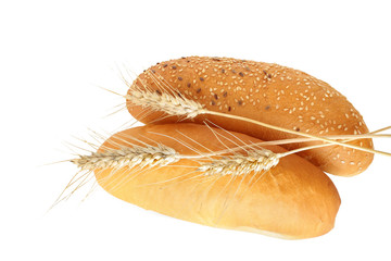 Bread rolls and wheat ear isolated on white background
