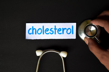 Conceptual image with Cholesterol inscription with the view of stethoscope, in someone hand with...