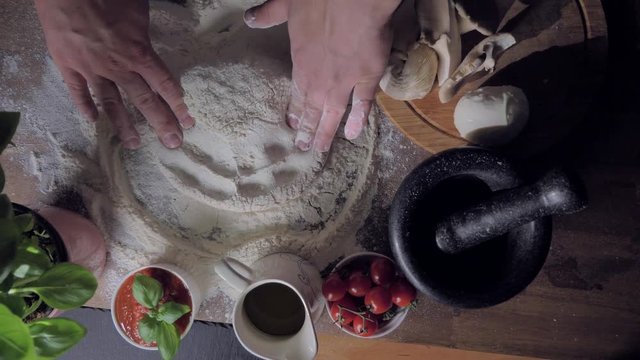 Macking pizza in slow motion - top view