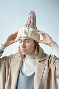 Woman demonstrating knit hat