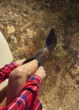 Cowboy boots on cowgirl