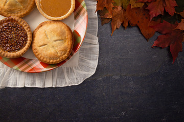 Holiday Table Set with Various Flavors of Fresh Baked Pies