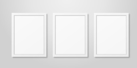 Three Vector Realistic Modern Interior White Blank Vertical A4 Wooden Poster Picture Frame Set Closeup on White Wall Mock-up. Empty Poster Frames Design Template for Mockup, Presentation