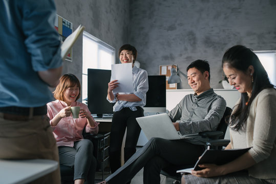 Smiling Business People Working In Office