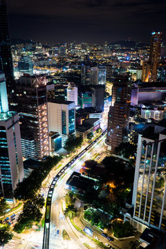 An overhead view of a busy city street at night