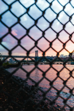 Williamsburg Bridge behind a Fance. New york City