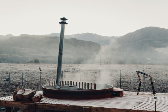 Steaming hot tub on misty morning