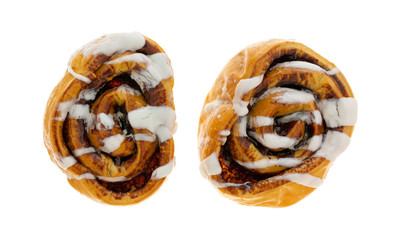 Overhead view of  two freshly baked cinnamon rolls isolated on a white background.