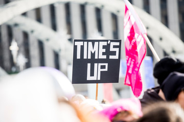 Women's March Toronto, Black sign with white lettering TIME'S UP