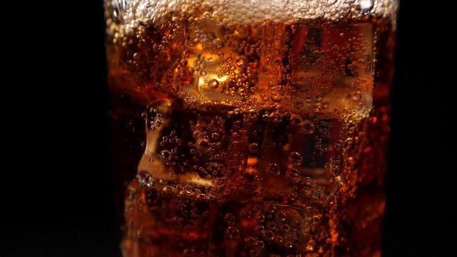 Fizzling coca cola in the glass