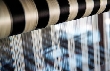 Silk Production Process, Silkworm cocoons.Colorful raw silk thread in country of asia.Raw silk thread background.Thai silk on the loom.Thai traditional weaving with  loom