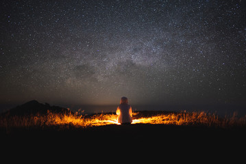 She watched the star and milky way on the mountain alone. She is happy to be with herself and stay with nature.