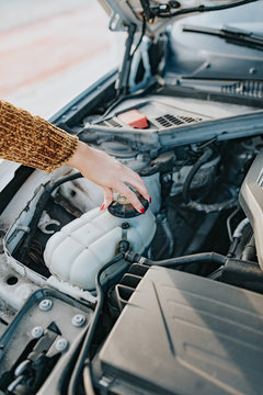 A woman with car problems