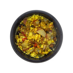 Top view of a microwaved scrambled egg burrito meal in a black tray isolated on a white background.