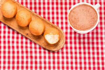 Traditional Colombian buñuelo - Hot chocolate drink