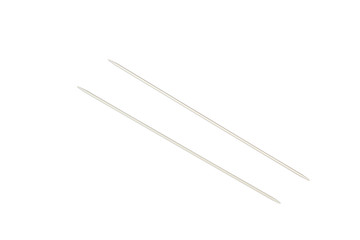 Knitting needles on white background