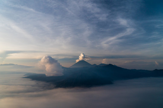 Volcanoes erupting at dawn