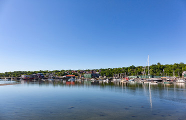 Fototapeta na wymiar Wide view of the Belfast, Maine waterfront on a bright summer day.