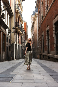 Trendy woman on street of old city