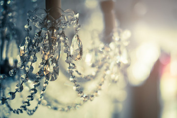 abstract image background of blur bokeh and crystal chandelier light equipment filter tone color...