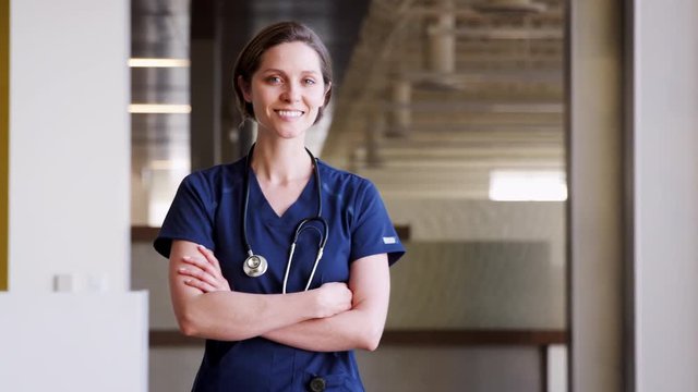 Young female doctor wearing scrubs