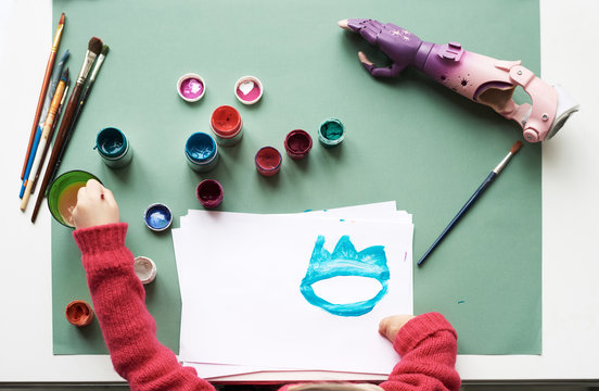 Disabled girl painting picture