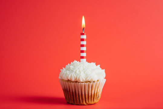 Red Striped Candle On A Birthday Cupcake