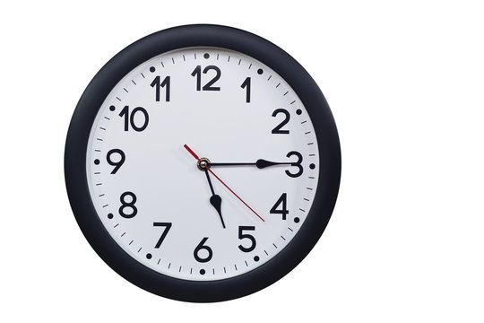 Time concept with black clock at a quarter past five am or pm