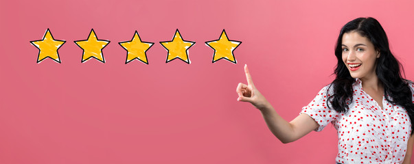 Five star rating with young woman on a pink background