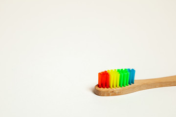 Toothbrush on gray background. Concept toothbrush selection, bamboo eco-friendly