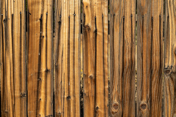 Weathered brown wood background surface. Wooden wall texture rustic planks with nails.